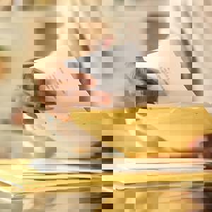 Person opening envelopes
