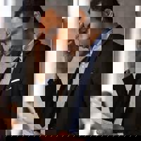 Man looking worried holding paper