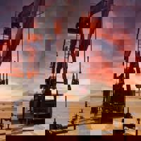 Oil refinery in desert at sunset